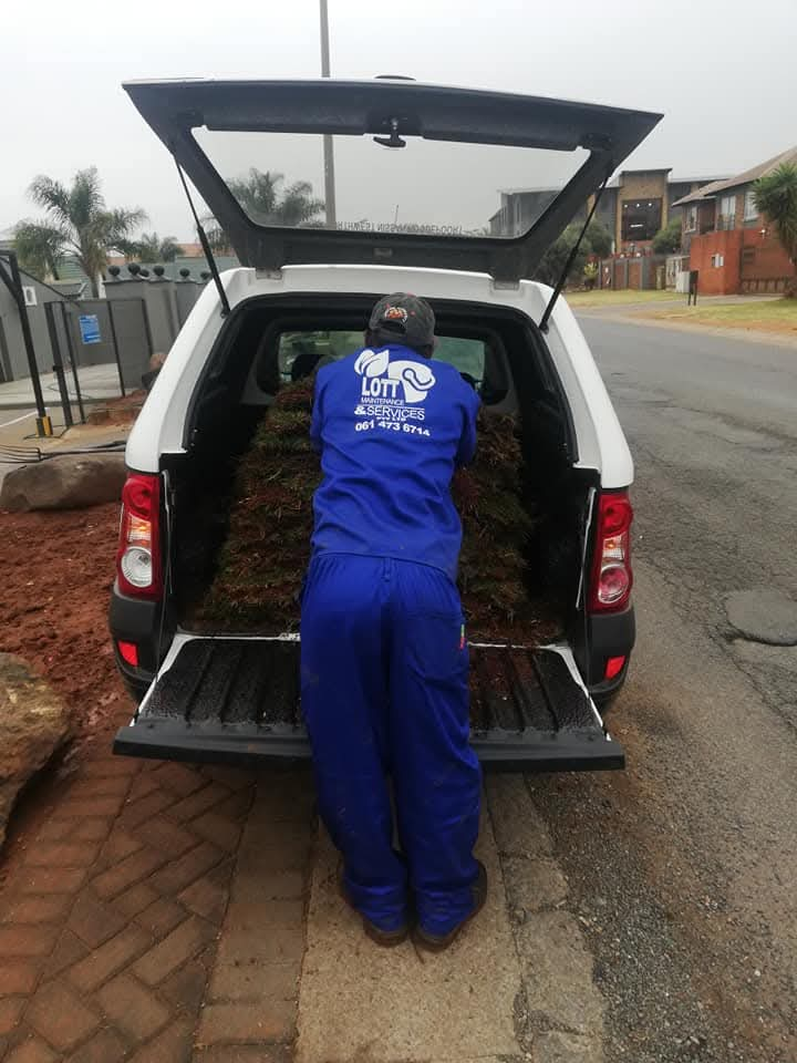 Lott Maintenance worker loading garden waste